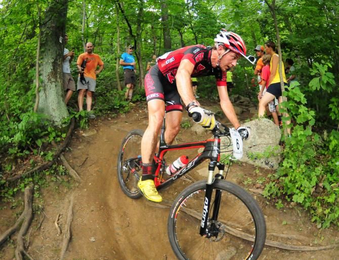 Colin Cares (Kenda/Felt) rounding a tight corner on the descent
