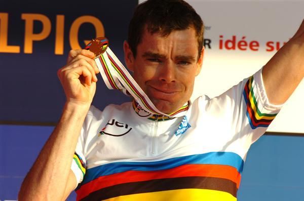 Cadel Evans smiles as he presents his medal and jersey in Mendrisio, Switzerland.