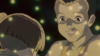 Seita and his sister smiling amidst fireflies in Grave of the Fireflies