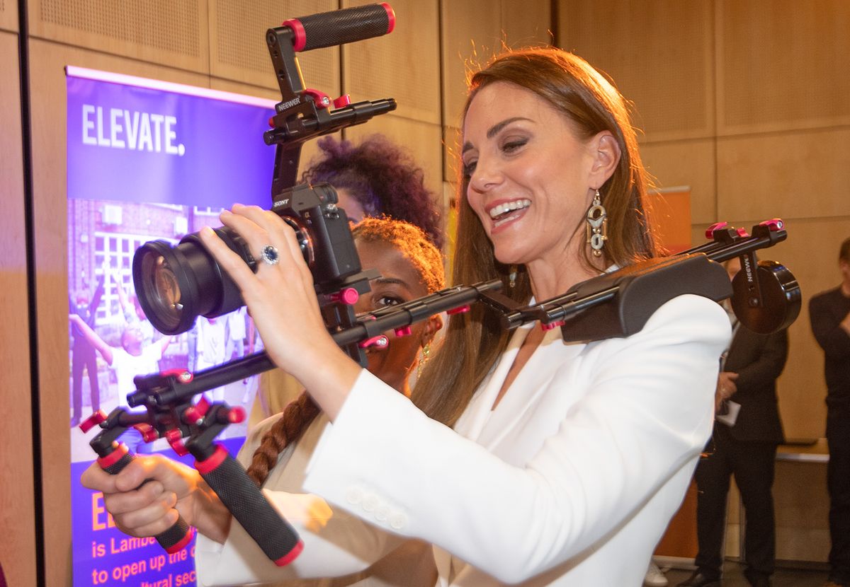 Catherine, Duchess of Cambridge holds a Sony mirrorless camera while speaking to people from the ELEVATE initiative at Brixton House on June 22, 2022 in London, England. (Photo by Eddie Mulholland - WPA Pool/Getty Images)