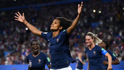 France defender Wendie Renard celebrates after scoring the retaken penalty against Nigeria 