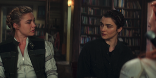 Florence Pugh with Rachel Weisz during family table scene in Black Widow