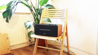 the edifier d12 wireless speaker on a chair