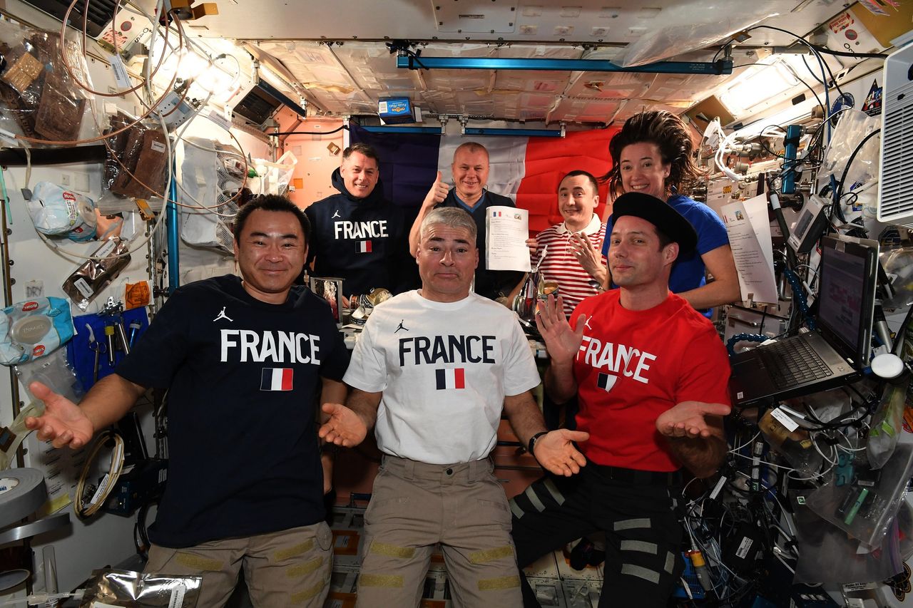 French astronaut Thomas Pesquet of the European Space Agency celebrated France's Bastille Day holiday in space with festive shirts and a meal with friends on July 14, 2021 aboard the International Space Station.