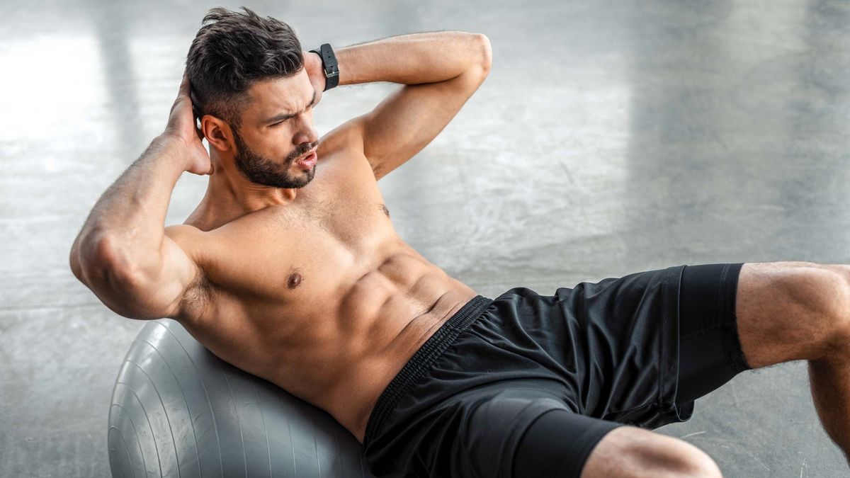 a photo of a man doing sit-ups 