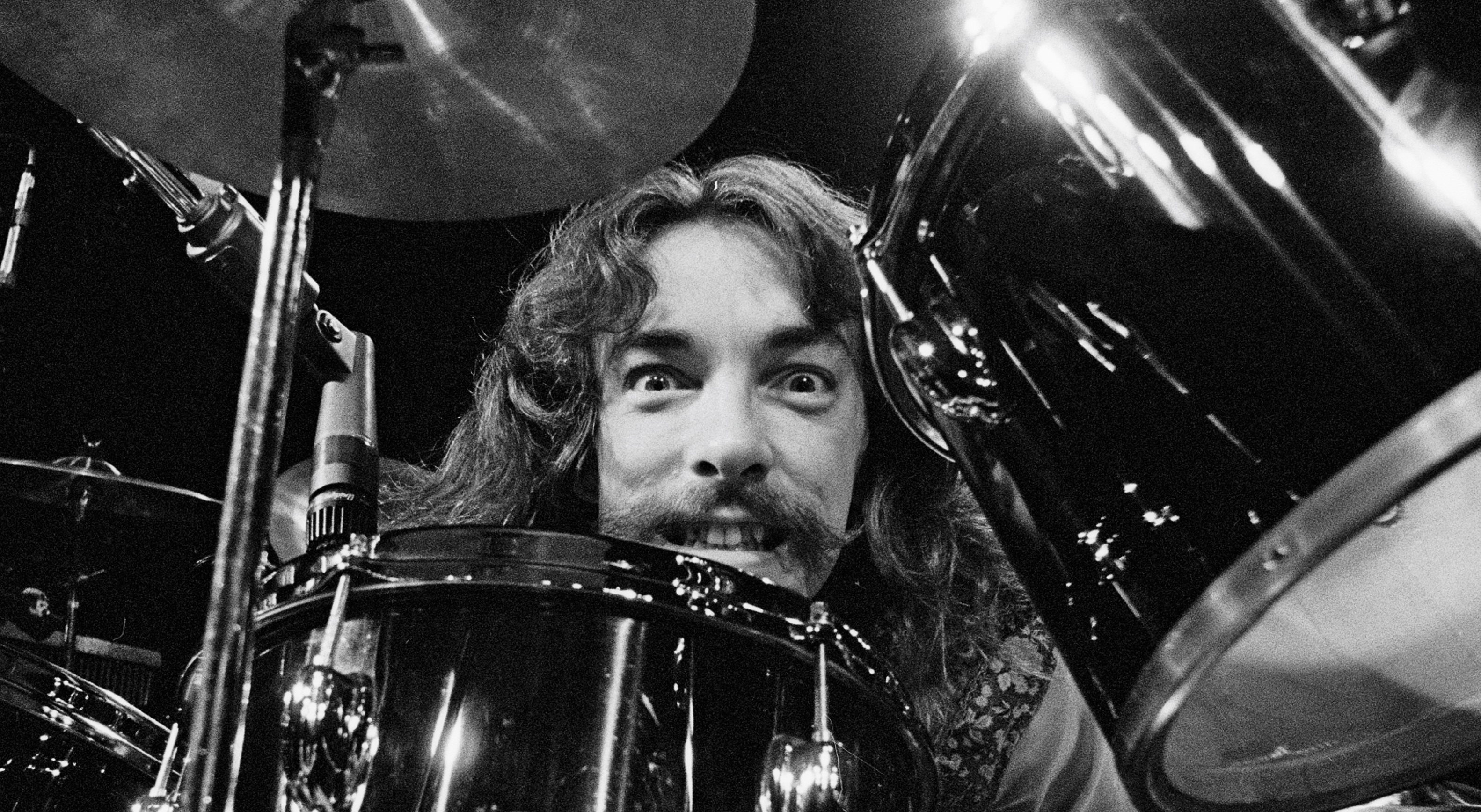 Drummer Neil Peart from Canadian band Rush performs live on stage at the Aragon Ballroom in Chicago, Illinois during their All The World's a Stage tour on 20th May 1977