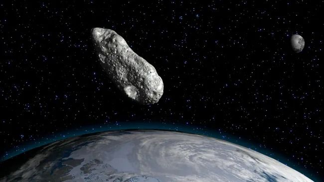 An illustration of an asteroid above Earth.