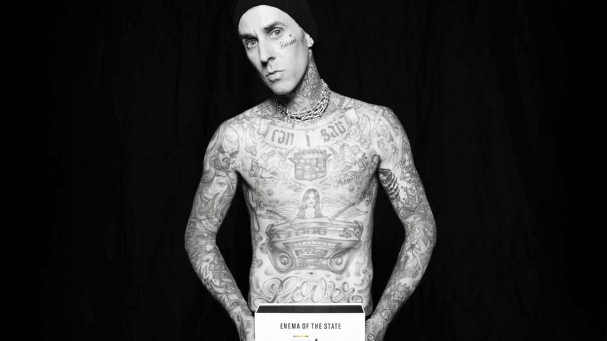 Travis Barker posing nude for Liquid Death