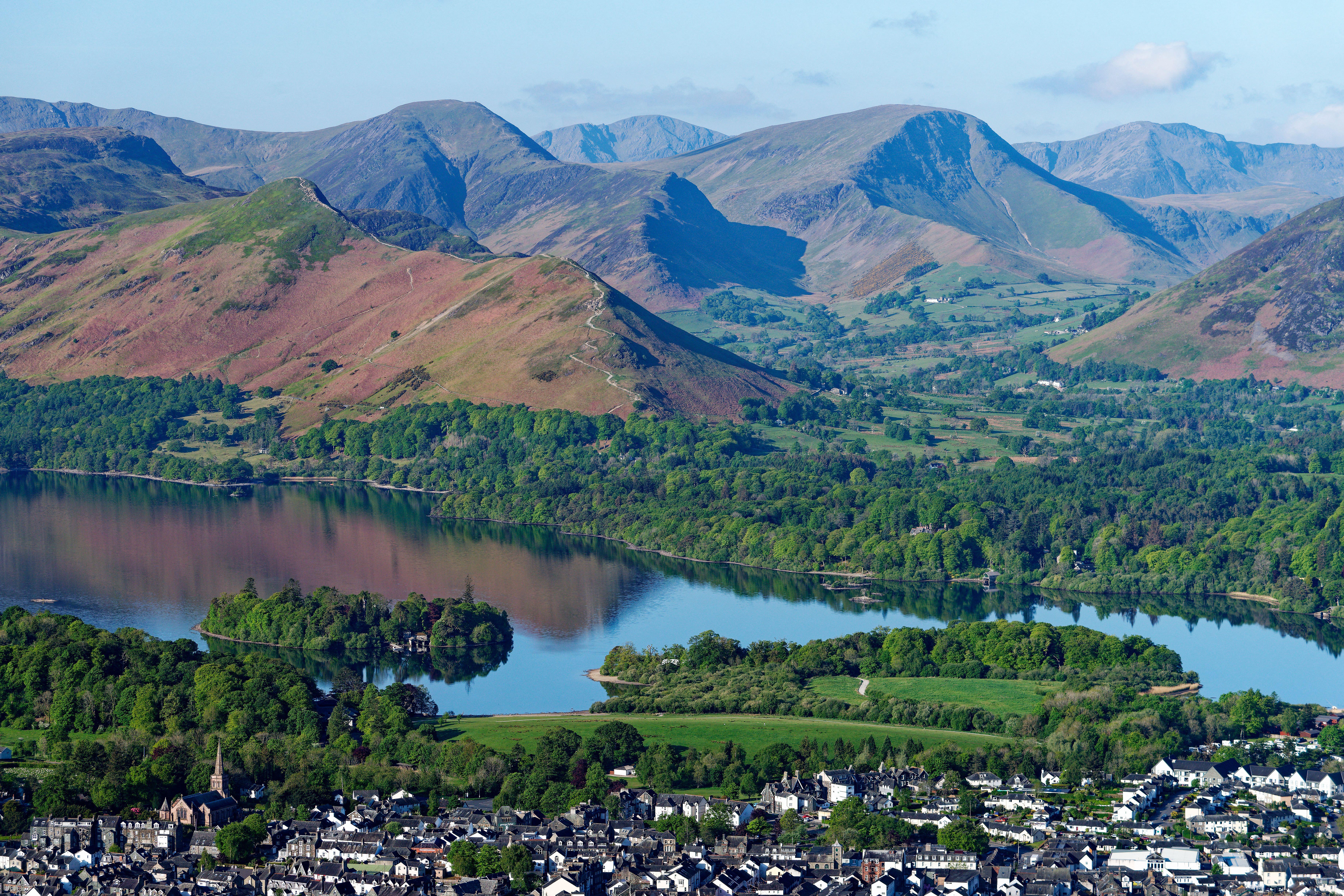 A view over Keswick town and Derwentwater to Cat Bells and Newlands in the Lake District. 