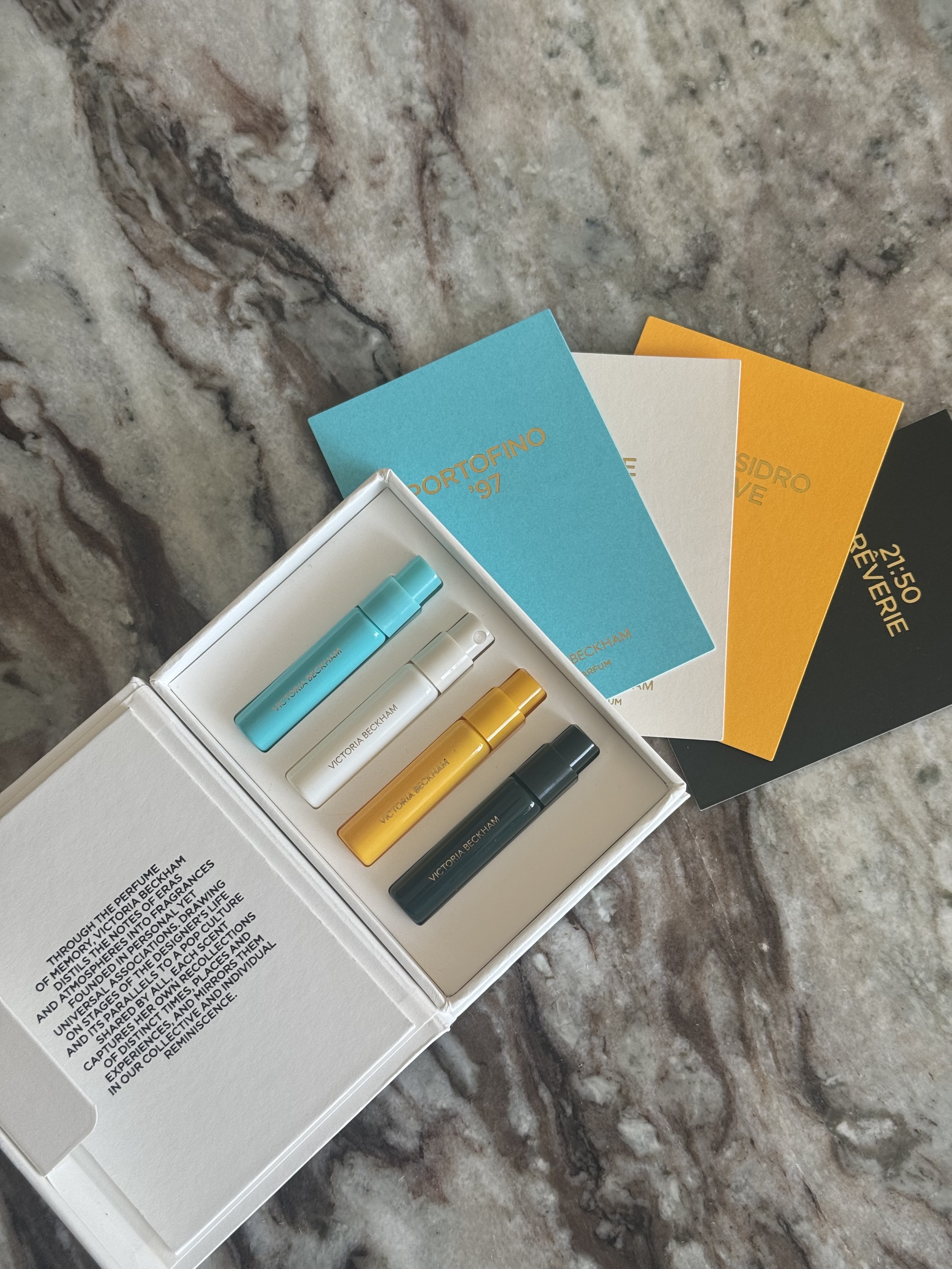 A victoria beckham beauty perfume discovery set on a marble table