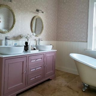 Bathroom with sulking room pink cabinet
