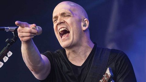 Devin Townsend points at the audience from stage