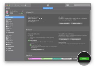 Enabling device backups to iTunes showing how to click Done when your backup is finished