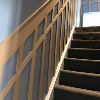 stair case with grey wall