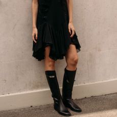 Woman in tall riding boots