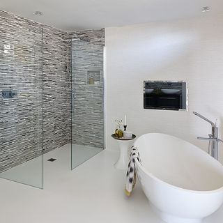 en suite bathroom with walk-in shower and bathtub