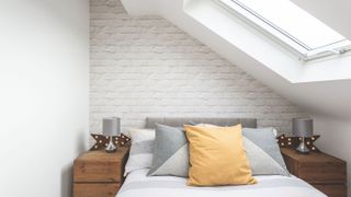bedroom in loft conversion with white scheme photographs by fraser marr