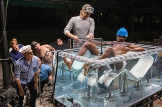 Eric Manaka prepares for a water stunt as Johnny Knoxville and team watch in Jackass Forever.
