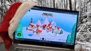HP laptop wearing a Santa hat set on a snowscape