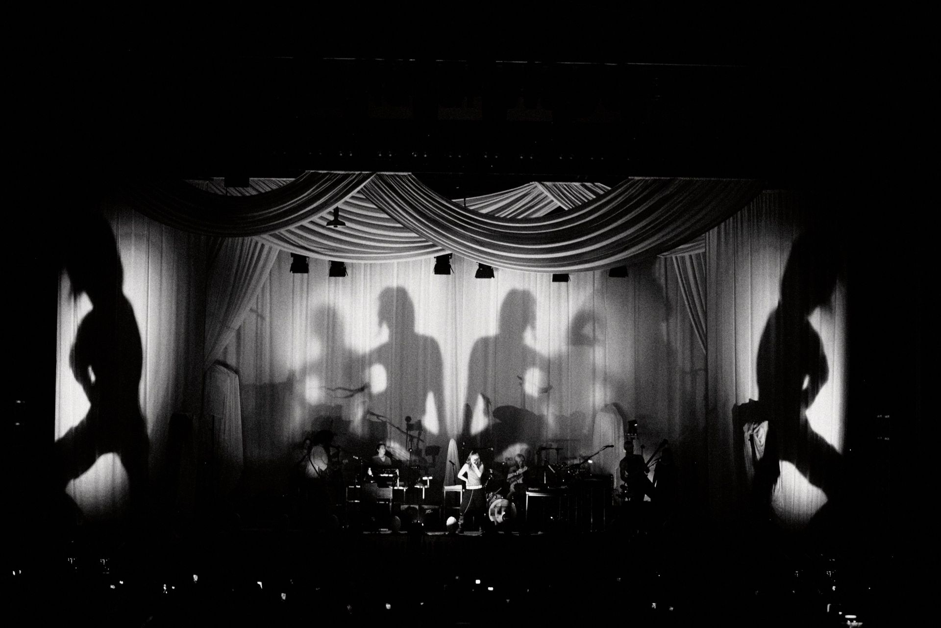 bands on stage in pink light