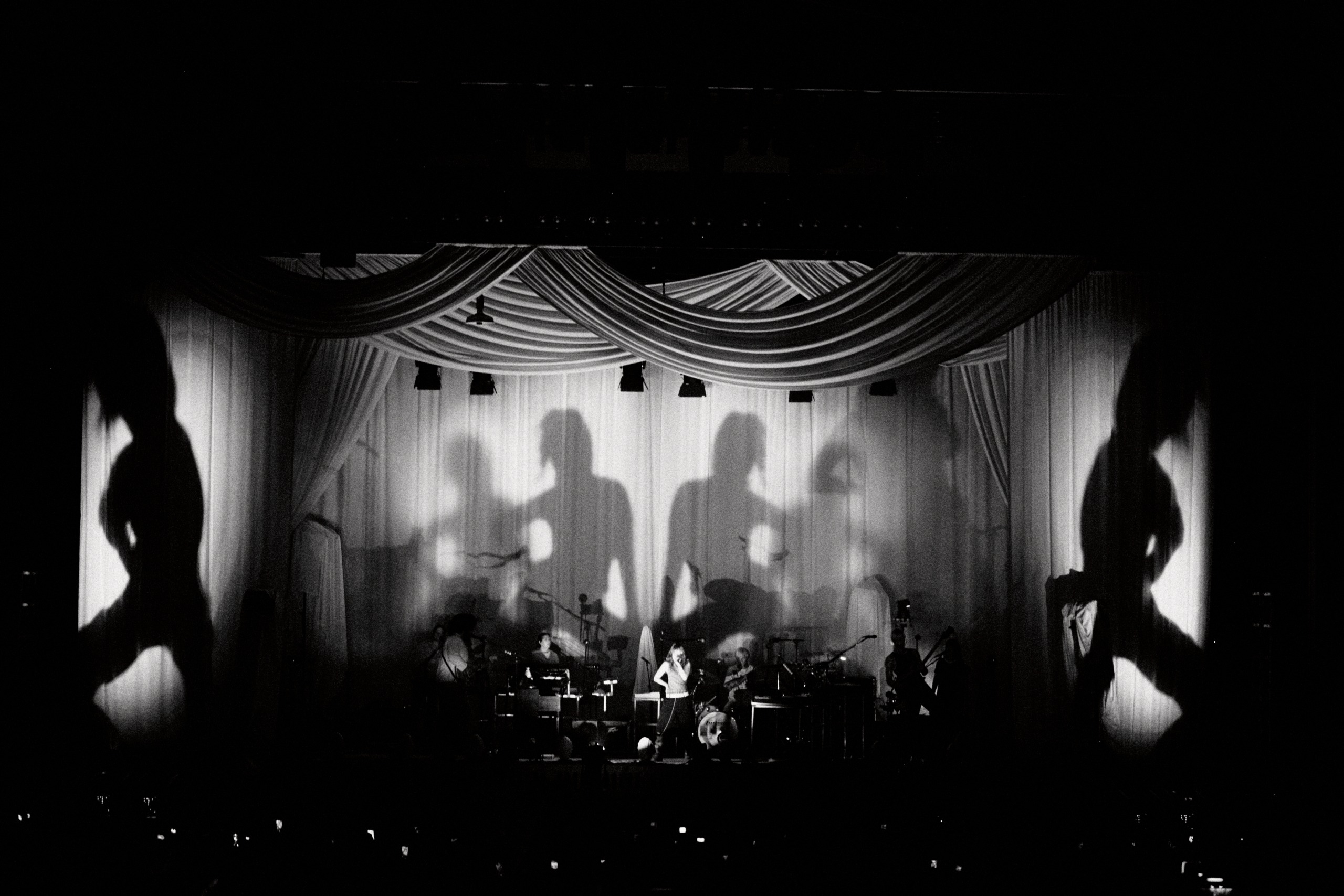 bands on stage in pink light