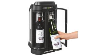 The two capacity EuroCave wine cooler with two bottles, one being inserted, the other is already in