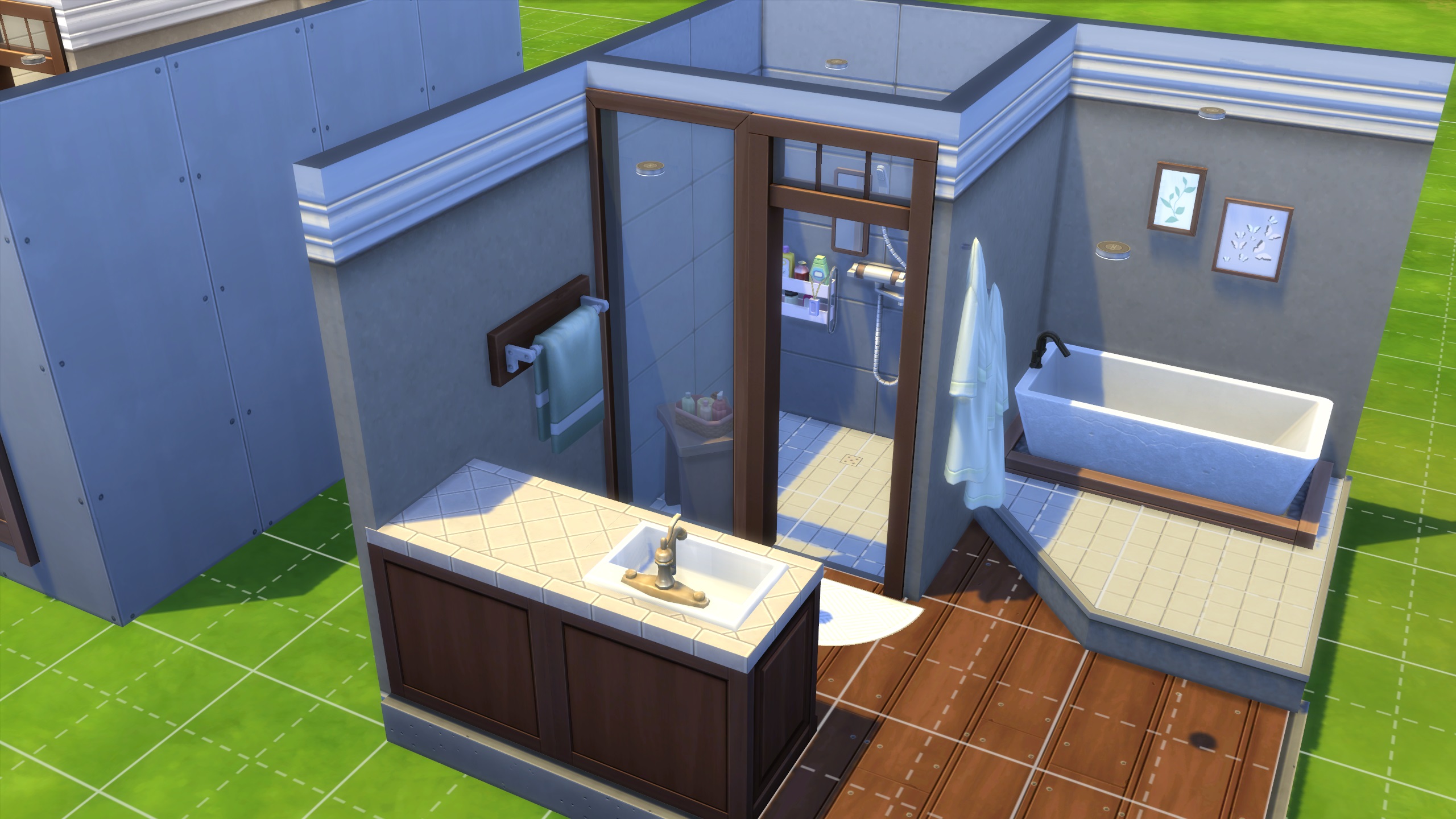 Suggerimenti per la costruzione di The Sims 4: un bagno piccolo con una piattaforma rialzata che conduce a una vasca e una doccia che scende