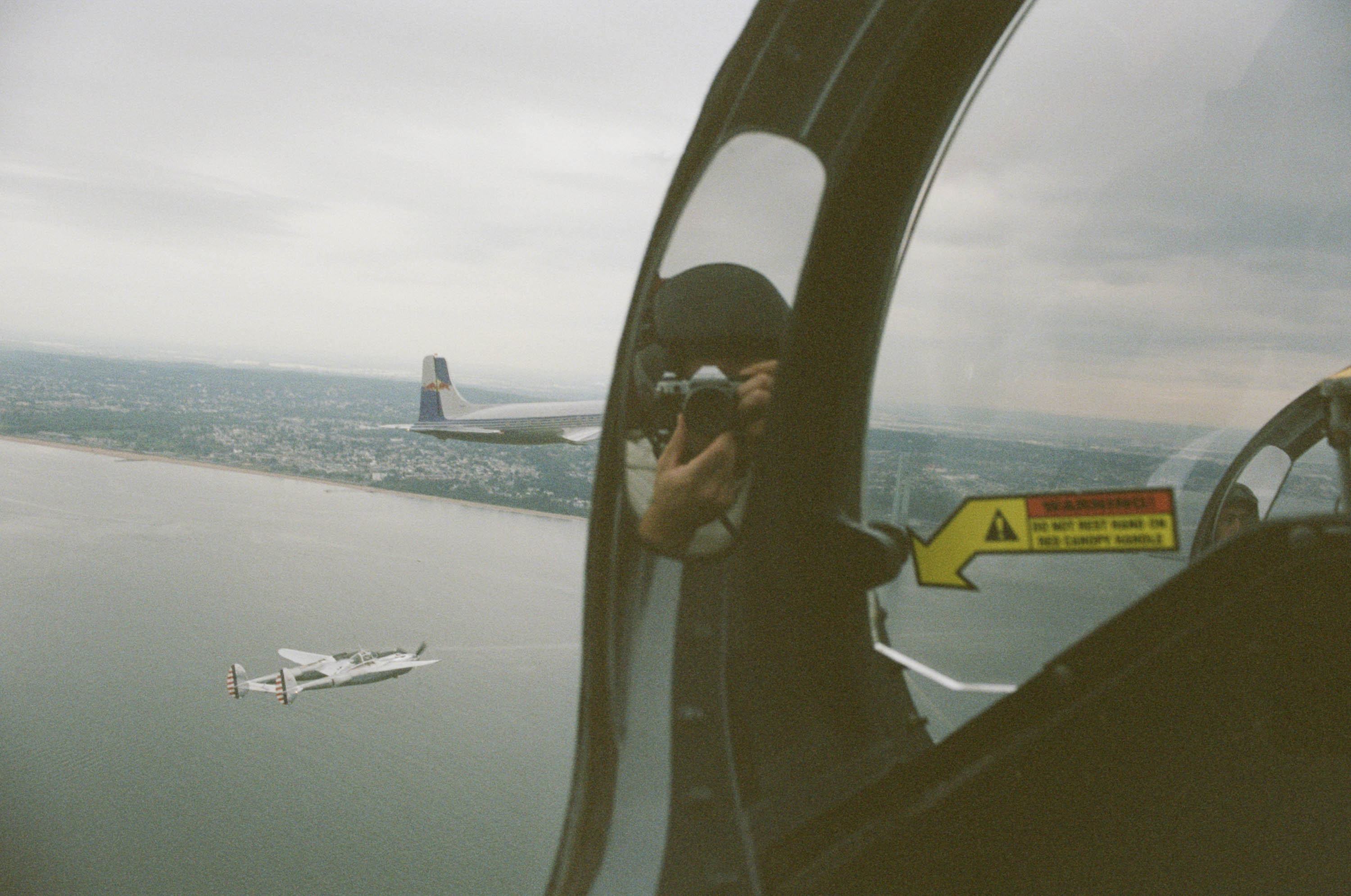 Photos from the Red Bull Flying Bulls Douglas DC-6B flight shot using vintage cameras