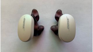 Bose QuietComfort Earbuds with purple Avery customized eartips on white background