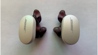 Bose QuietComfort headphones with purple Avery custom eartips on white background
