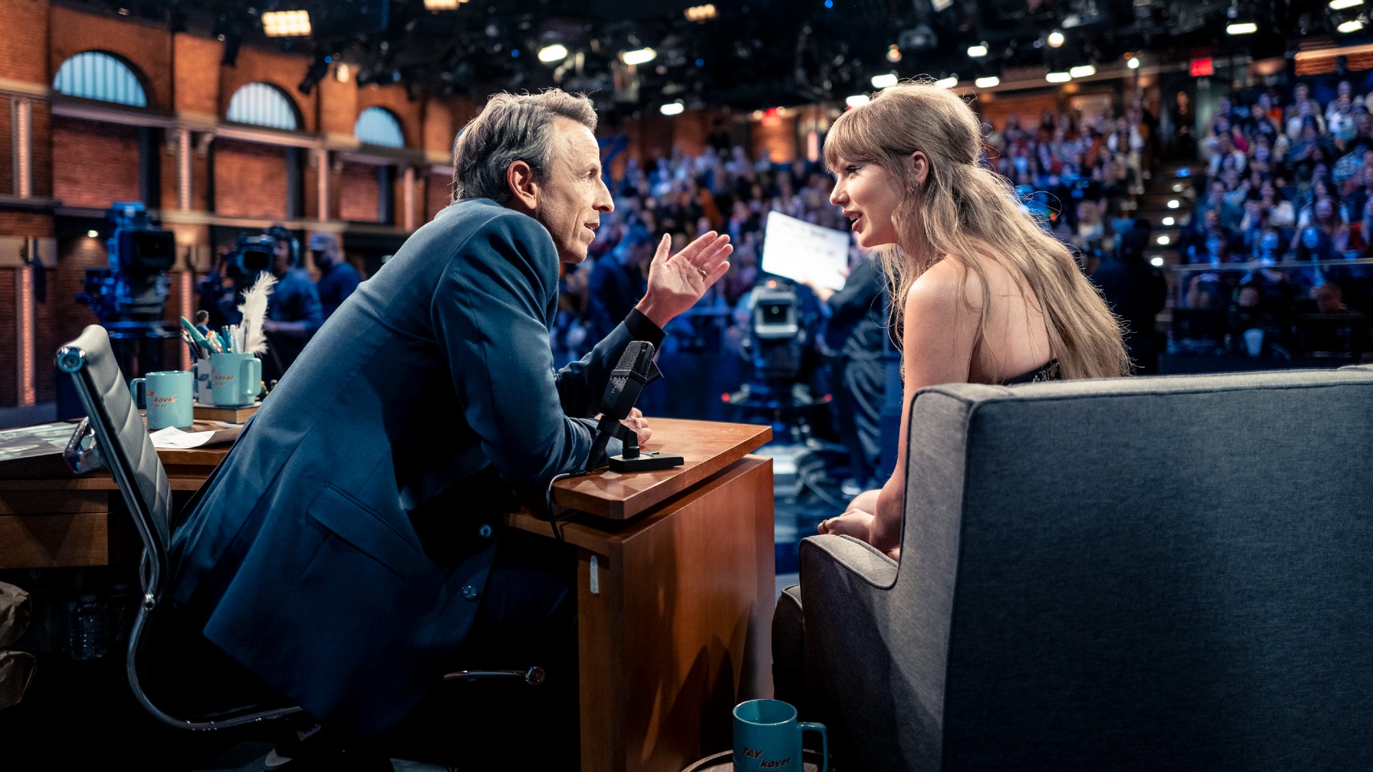 Seth Meyers talks to Taylor Swift during a talk show appearance