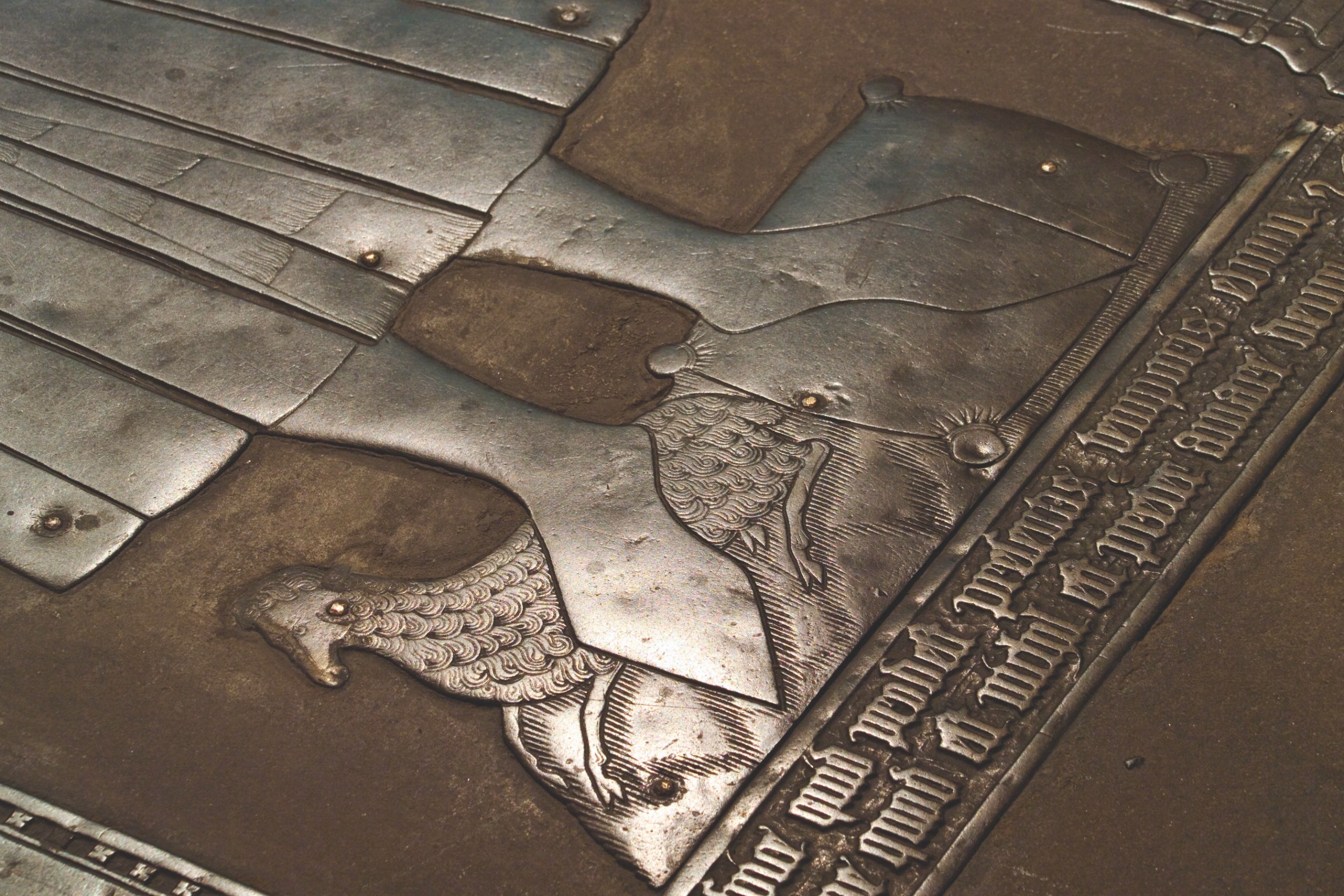 A sheep and woolpack in brass at the feet of John Fortey, who died in 1458.