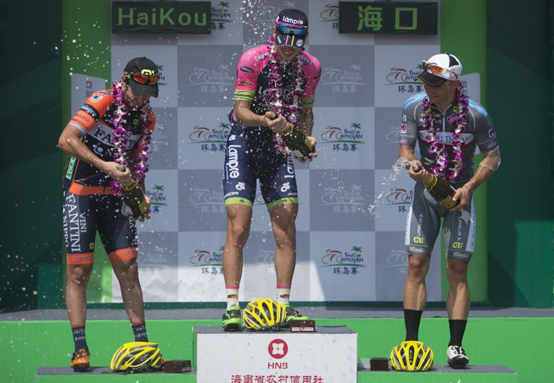 Sacha Modolo spraying the bubbly on the podium