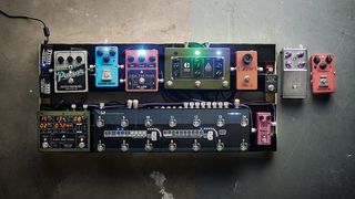 Overhead view of a well-stocked guitar pedalboard
