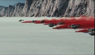 ships fly with red smoke in the last jedi