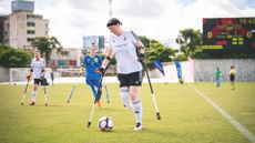 Sarah Haskins playing football