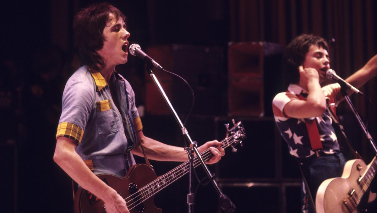 Ian Mitchell and Stuart Wood of the Bay City Rollers performing on stage 