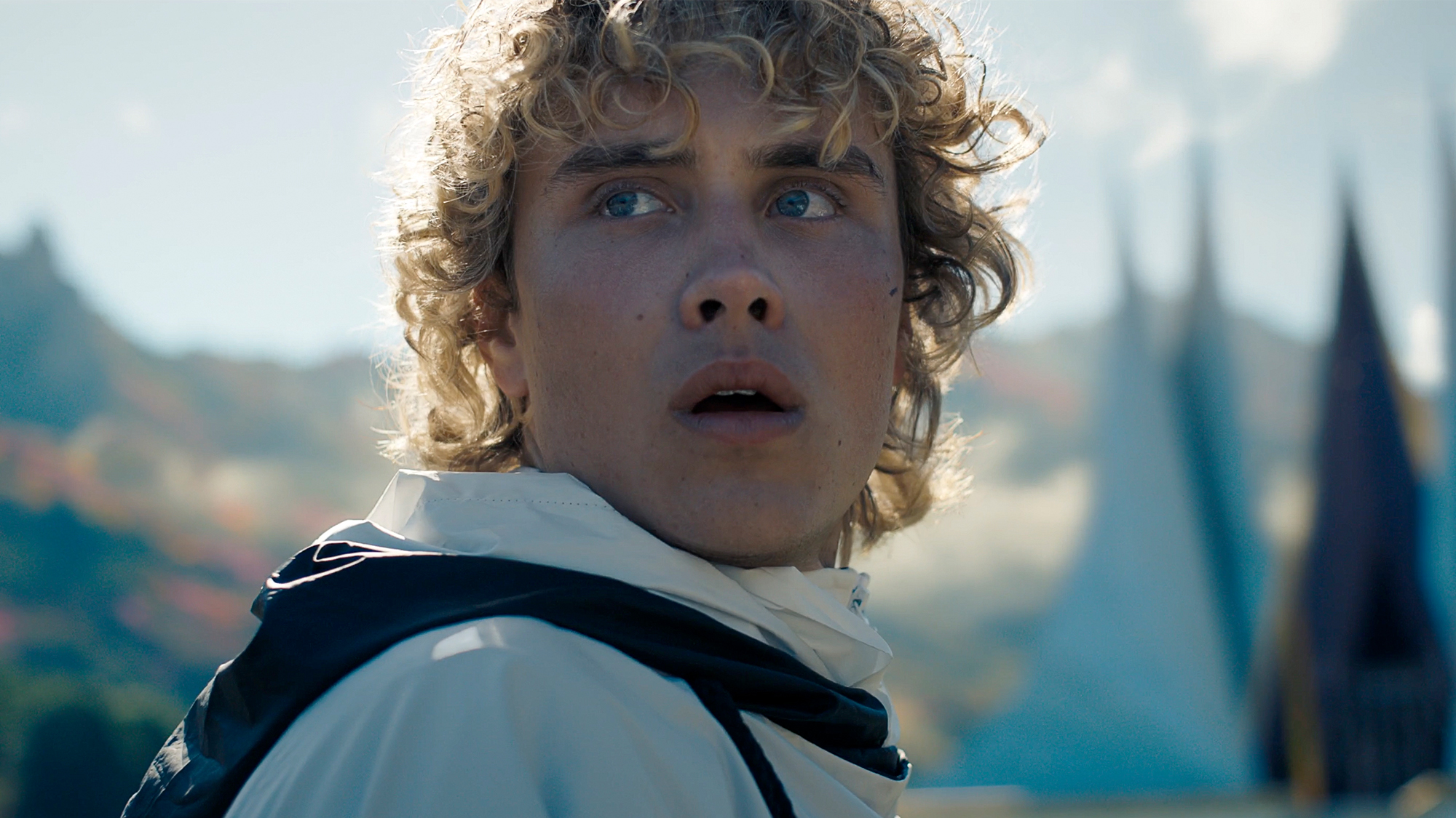 Joseph Zada looking scared while checking behind himself in Sunrise on the Reaping