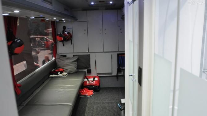 The rear lounge area of the bus has a pair of showers on the right, and room for three riders to change at once. It's also used for pre-race massage and meetings.