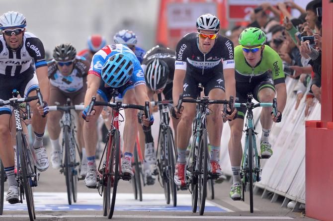 Tyler Farrar throws his bike to the line for third place