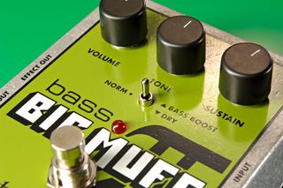 Close up of EHX Big Muff Bass pedal on green background