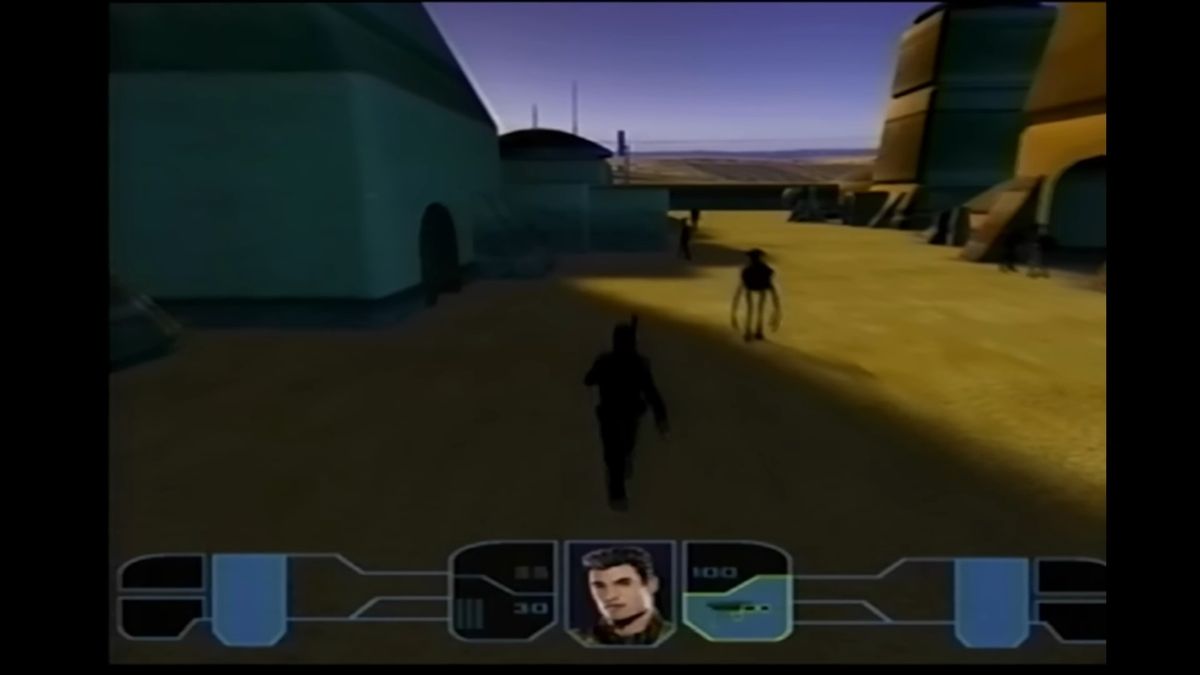 gameplay view walking down sandy street under clear sky in prototype kotor