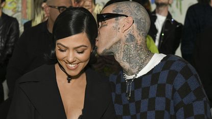 image of Kourtney Kardashian and Travis Barker attending the AMIRI Autumn-Winter 2022 Runway Show on February 08, 2022 in Los Angeles, California—to signify a story on Kourtney Kardashian IVF journey