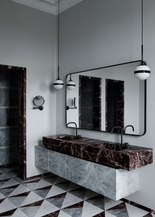 two toned sink with rosso levanto and a light marble, these two marbles are used for the floor tiling as well