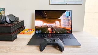 Dell XPS 17 (2023) review unit on a desk, playing Cyberpunk 2077