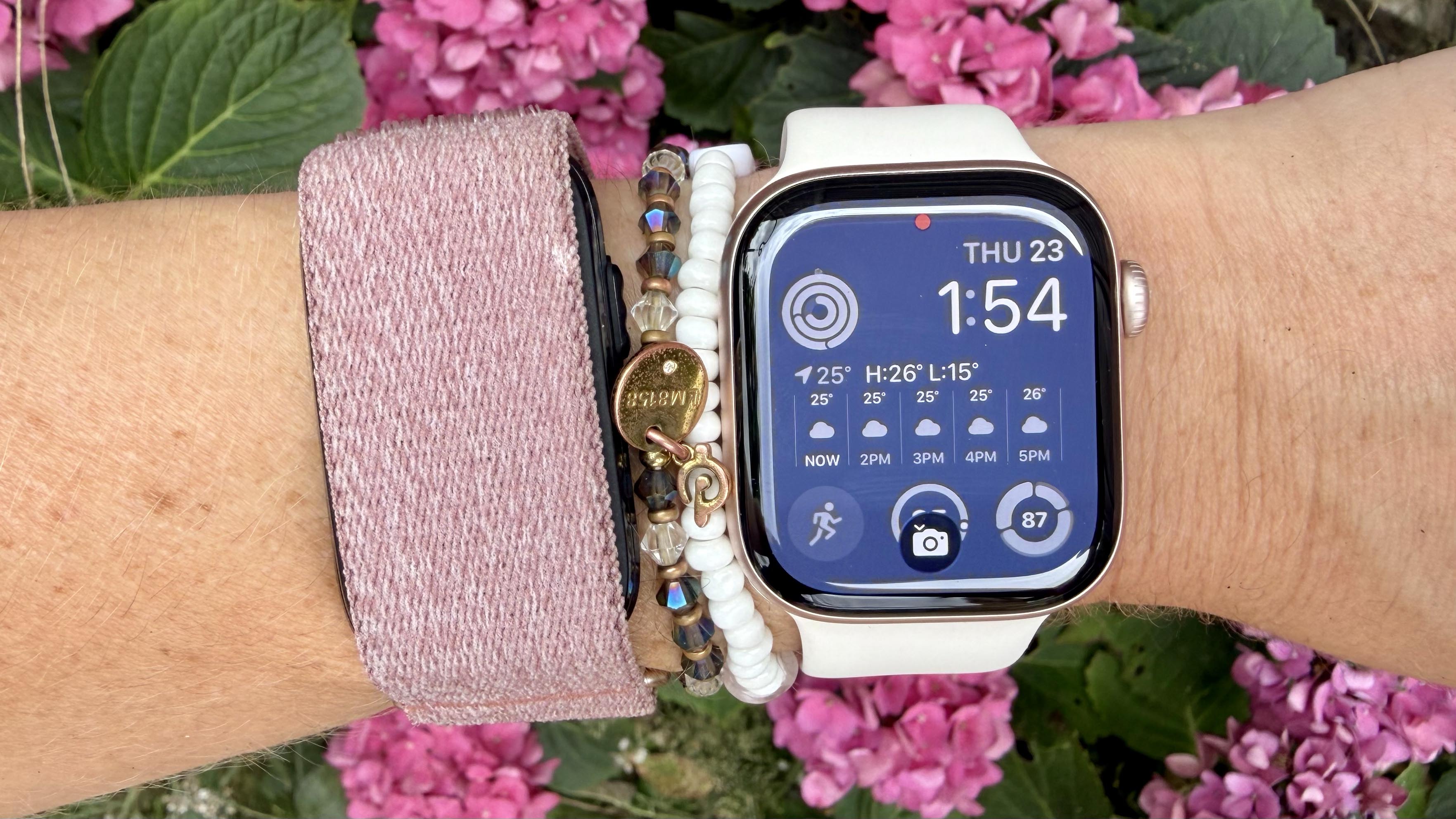 a photo of the Garmin Cirqa and Apple Watch 11