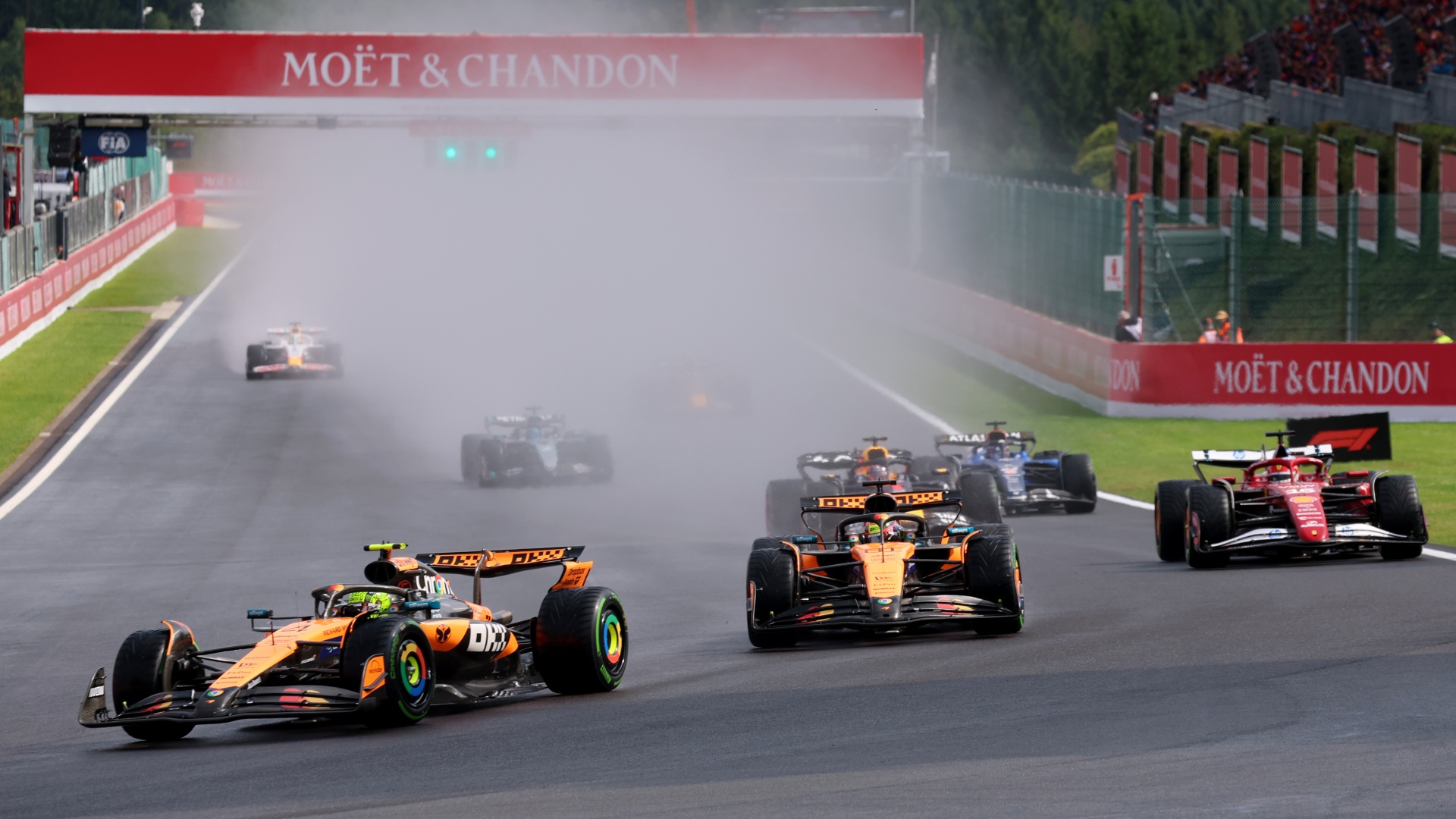 Lando Norris leads Oscar Piastri and Charles Leclerc on track during the F1 Grand Prix of Belgium at Circuit de Spa-Francorchamps on July 27, 2025 in Spa, Belgium