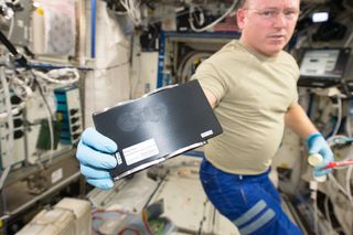 Expedition 42 Barry Wilmore Works with New 3-D printer