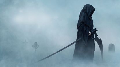 Grim Reaper in a fog-covered cemetery