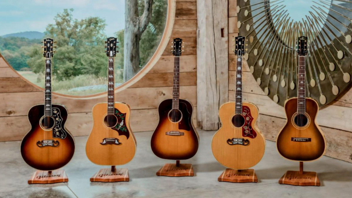 The new Gibson Murphy Lab Light Aged Acoustics released on 9 September 2025, all lined up in a wood-panneled show room with round windows and a rural landscape outside.